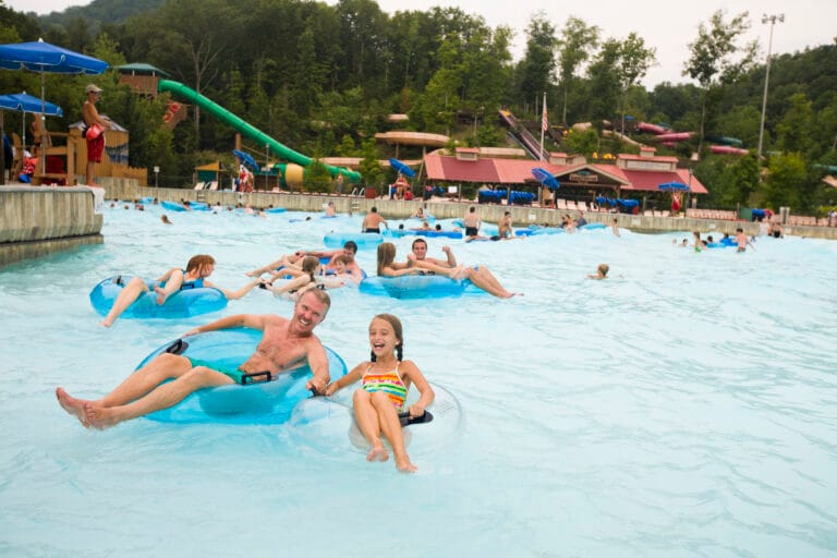 people swimming in mountain waves pool at splash country.