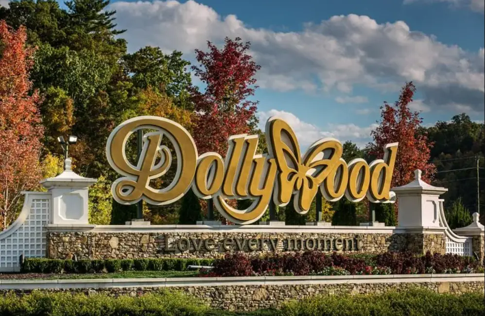Dollywood V.I.P. Parking: Is it worth the extra cost? 1 Dollywood theme park sign in fall with trees in the background