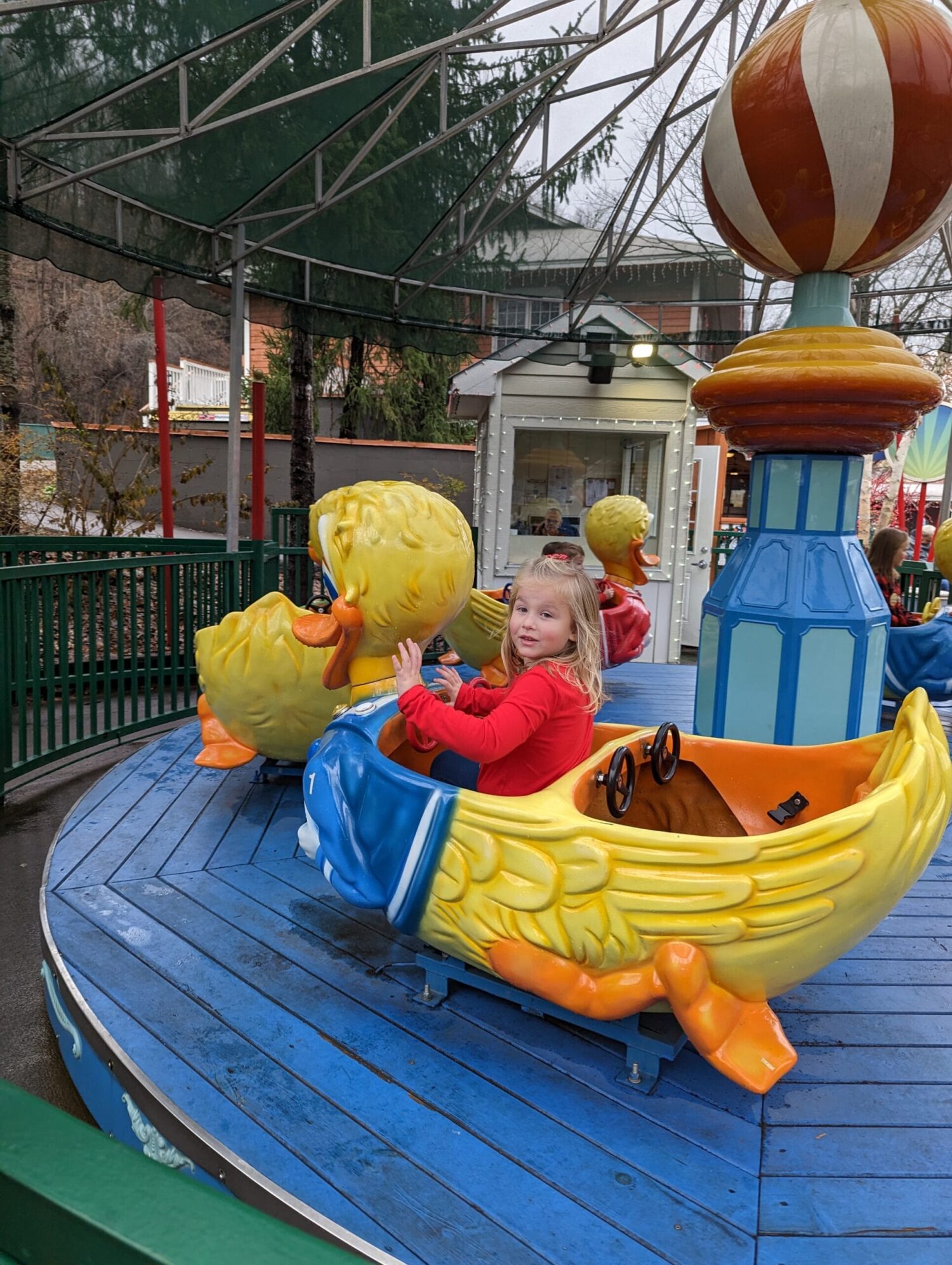 Conquering Dollywood with Kids: A Guide for Families 1 Girl riding Lucky Ducky ride at Dollywood