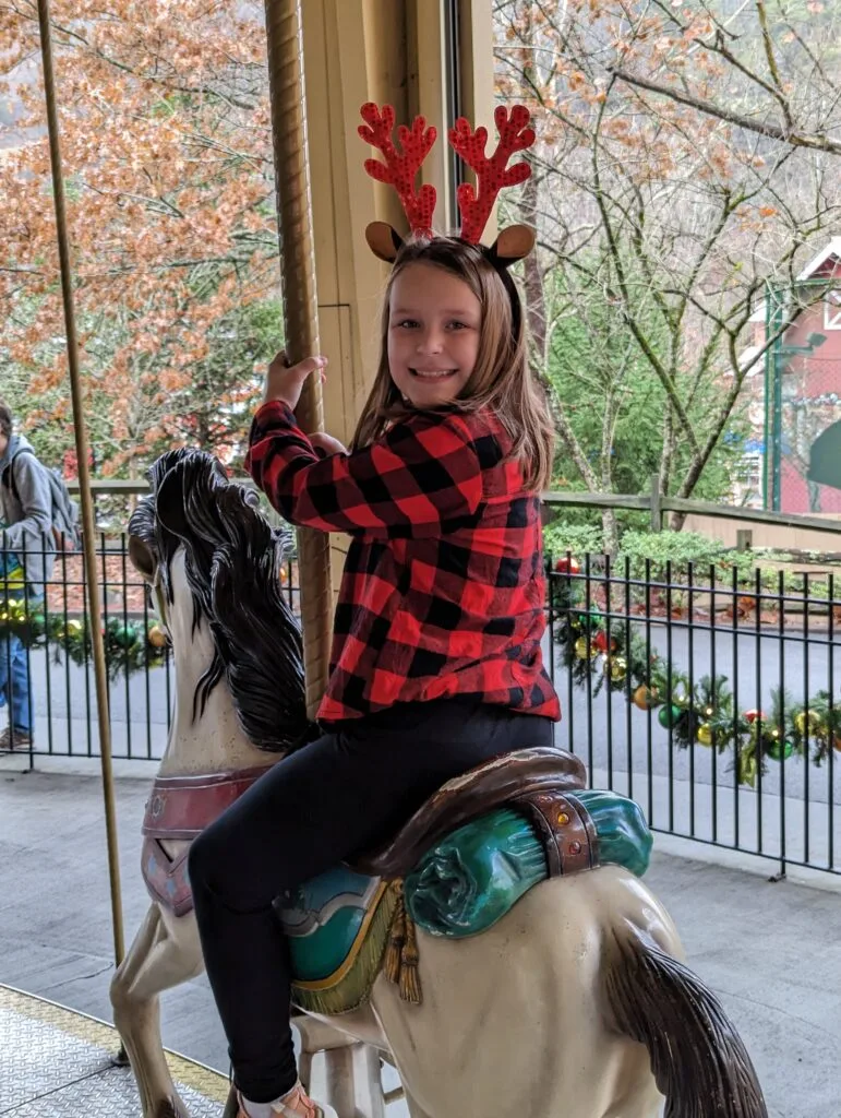 Your Ultimate Guide to Tripster Bundles for Dollywood & Beyond! 3 Child on Carousel at Dollywood