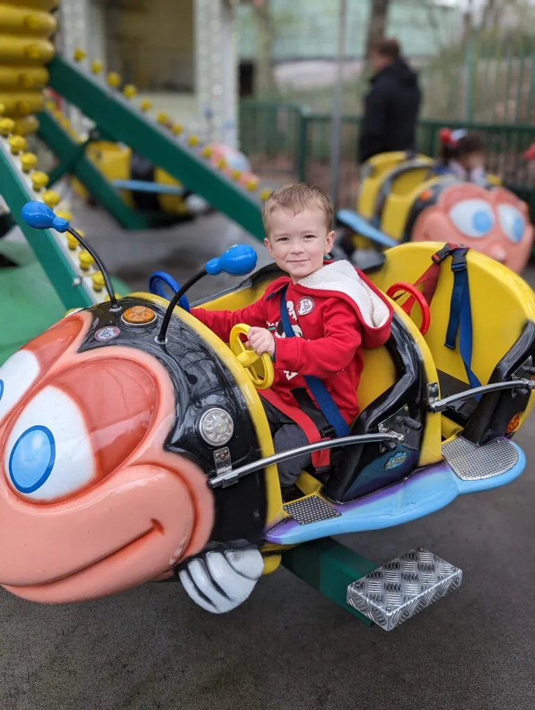 Child riding Busy Bees at Dollywood