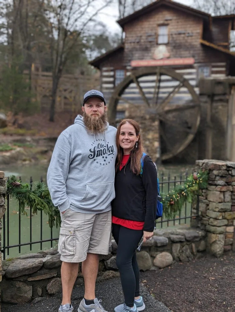 The Best Travel Agent Alternative for Planning Your Dollywood Trip 2 Owners of Simply Touring in front of Grist Mill