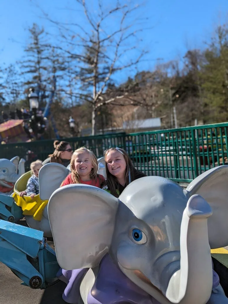 Why is Planning So Important? Maximize Your Dollywood Experience 2 Sisters riding The Amazing Flying Elephants ride at dollywood