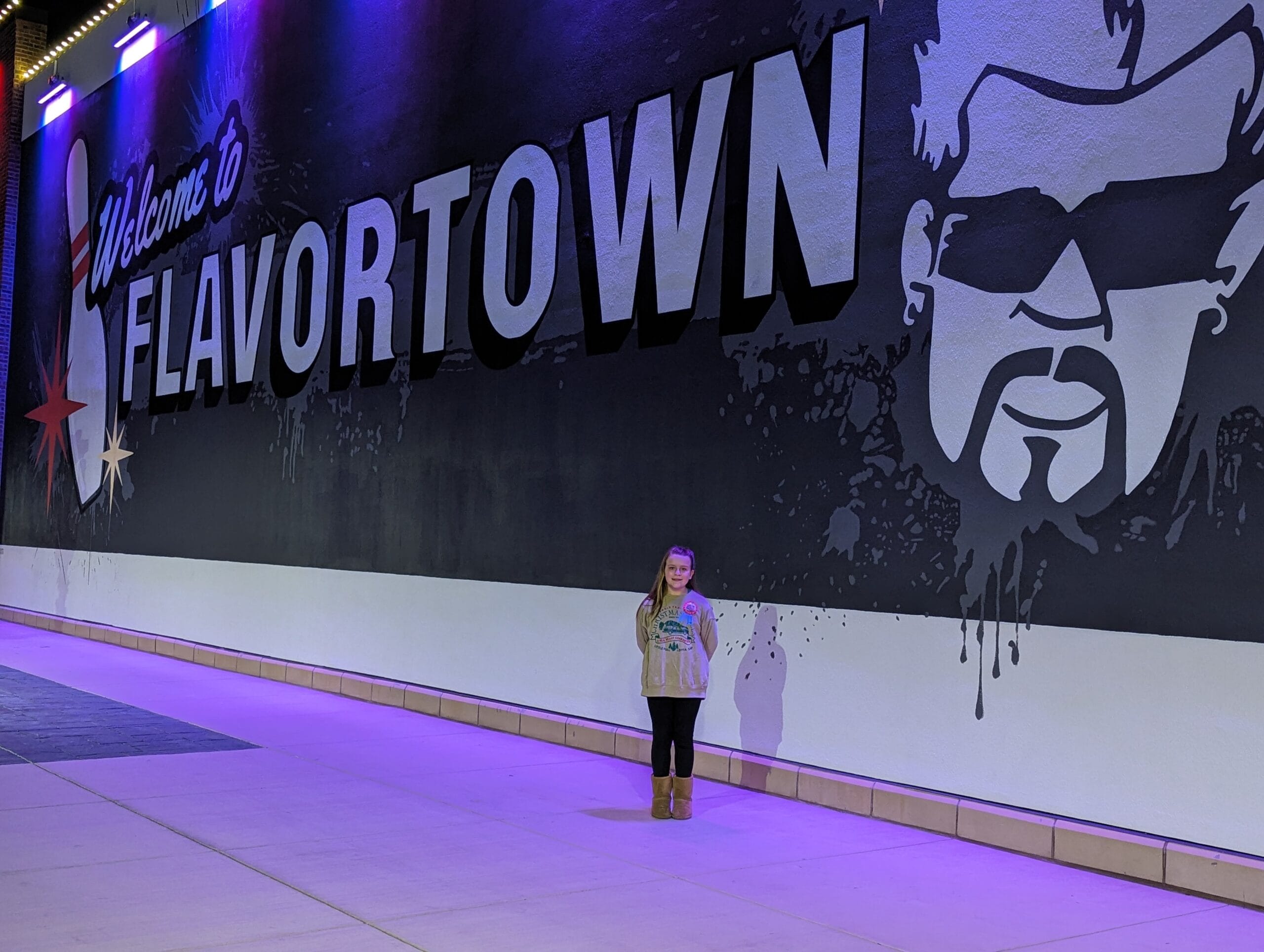 Your Guide to Downtown Flavortown in Pigeon Forge! Level Up Your Fun (and Your Flavor) 12 Child outside of Downtown Flavortown