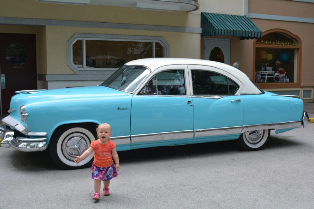 Child with car in Jukebox Junction