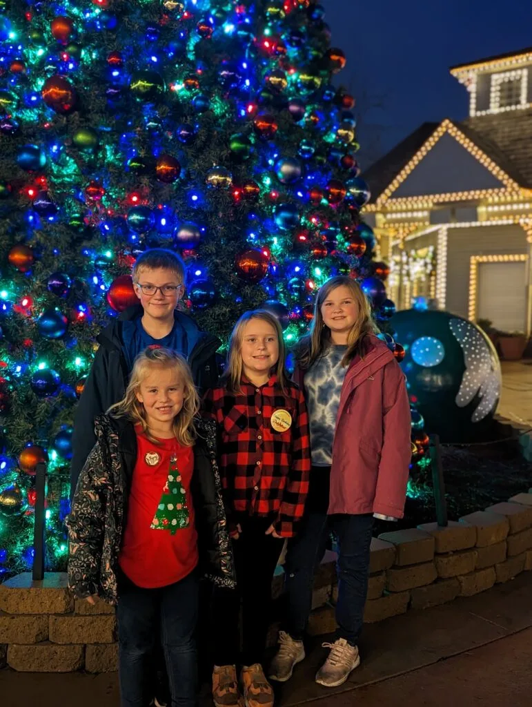 Children in front of Christmas Tree at Dollywood's Smoky Mountain Christmas Festival