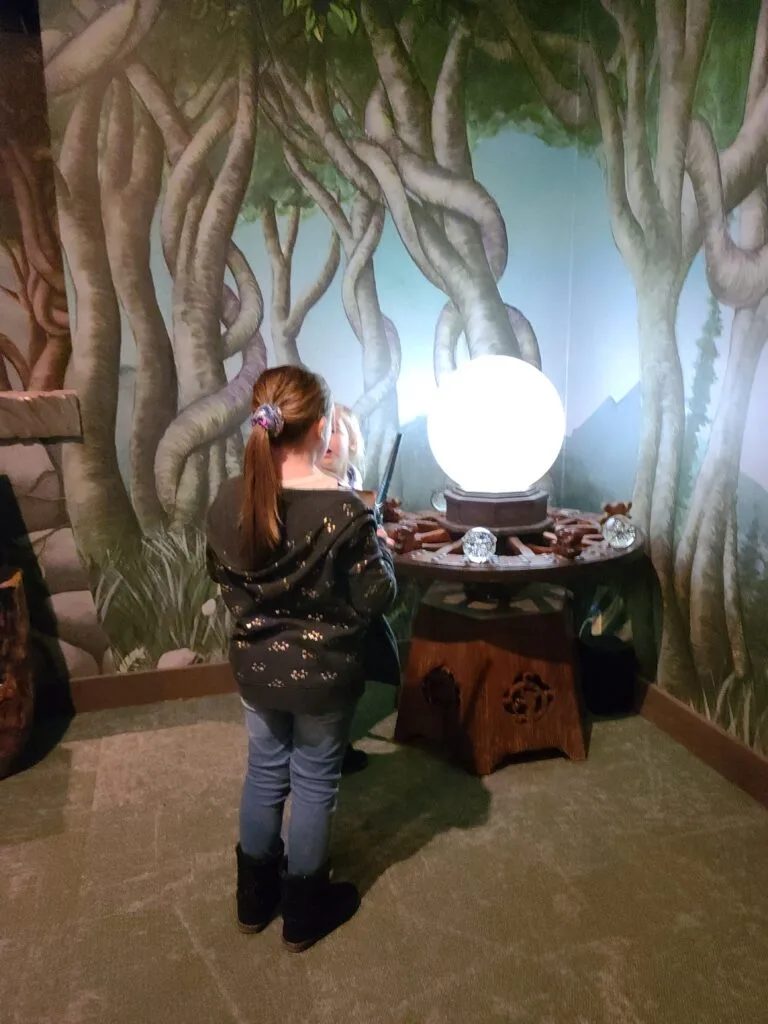 Child at crystal ball at MagiQuest in Pigeon Forge, TN Photo Credit: Lindsay Harvey-Simply Touring