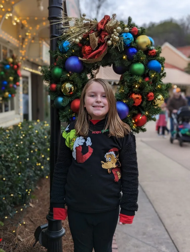 Child in front of The Spotlight Bakery at Dollywood's Smoky Mountain Christmas Festival Photo Credit: Lindsay Harvey-Simply Touring