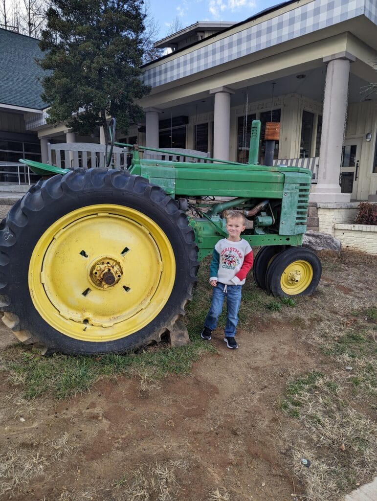 Child outside of the Ogle Brother's General Store in Sevierville, TN Photo Credit: Lindsay Harvey-Simply Touring