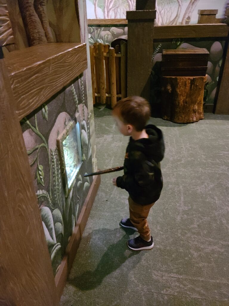 Exploring MagiQuest in Pigeon Forge, Tennessee 7 Child with wand at MagiQuest in Pigeon Forge, TN Photo Credit: Lindsay Harvey-Simply Touring