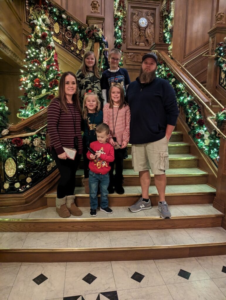 Family on staircase at Titantic Museum in Pigeon Forge, TN Photo Credit: Lindsay Harvey-Simply Touring