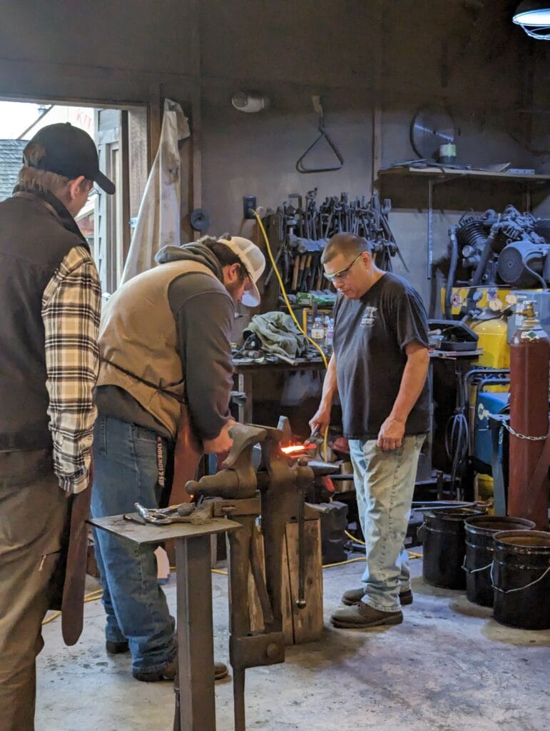 Hammering the knife at Iron Mountain Metal Craft in Pigeon Forge, TN Photo Credit: Lindsay Harvey-Simply Touring