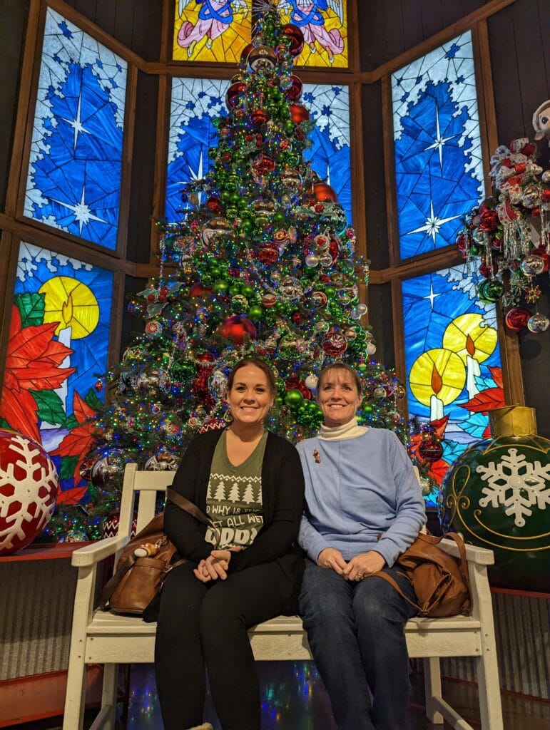 Lindsay Harvey in front of Christmas Tree at The Incredible Christmas Place in Pigeon Forge, TN