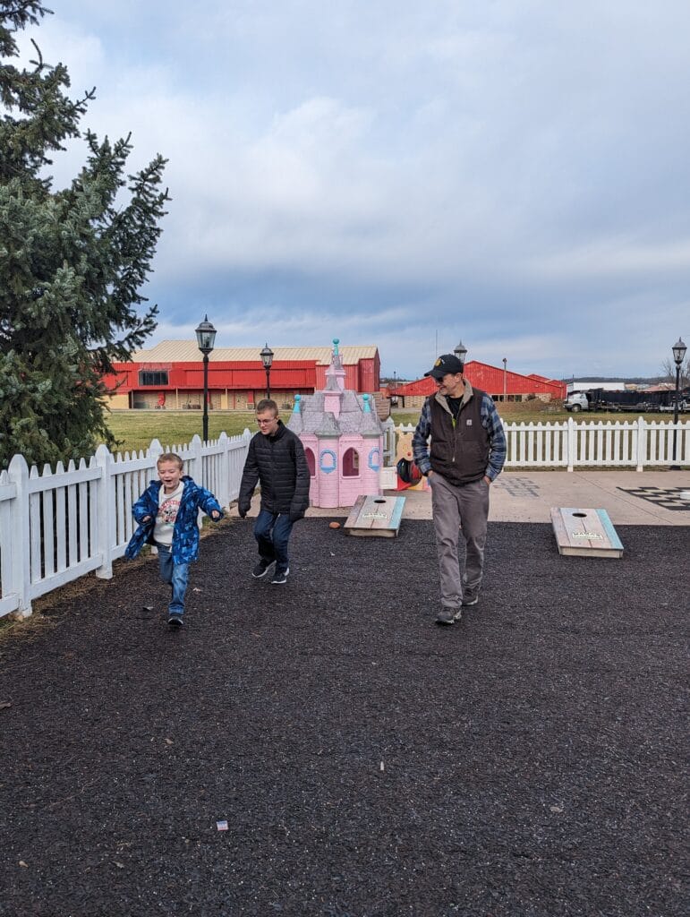 Mama’s Farmhouse in Pigeon Forge 6 Family playing outside at Mama's Farmhouse in Pigeon Forge, TN