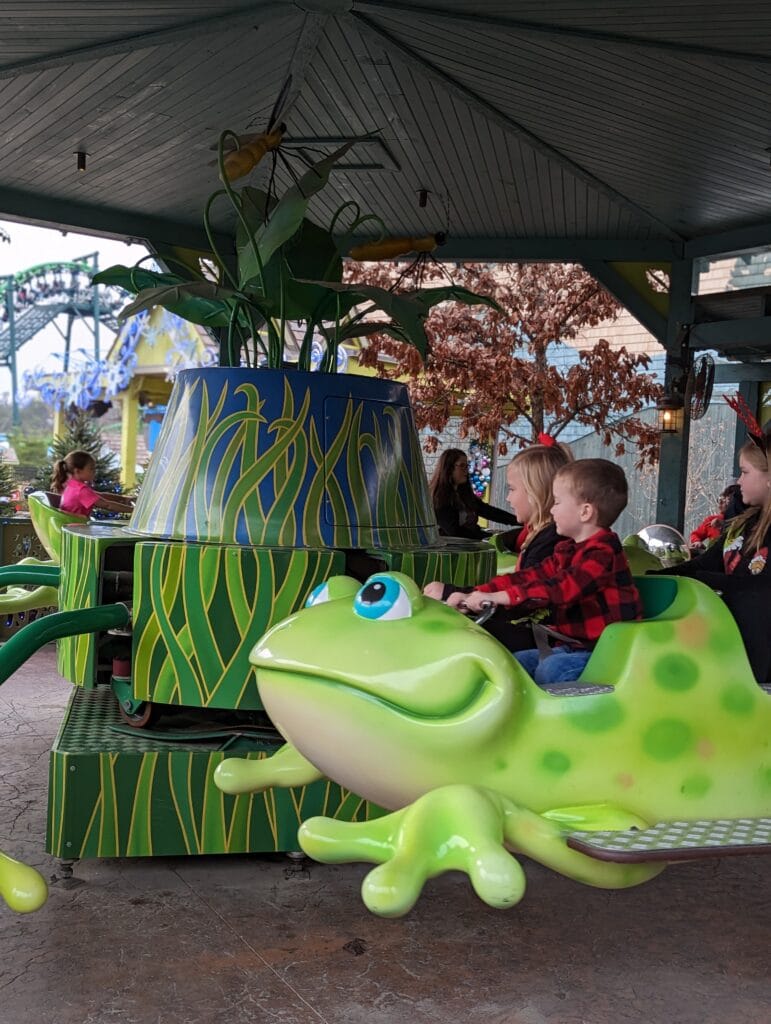 Kids riding Frogs and Fireflies in Wildwood Grove at Dollywood