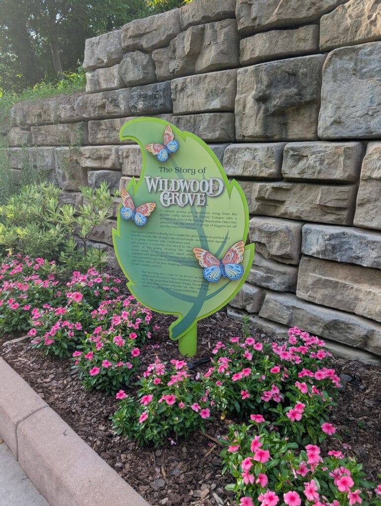 Wildwood Grove Sign with Flowers at Dollywood