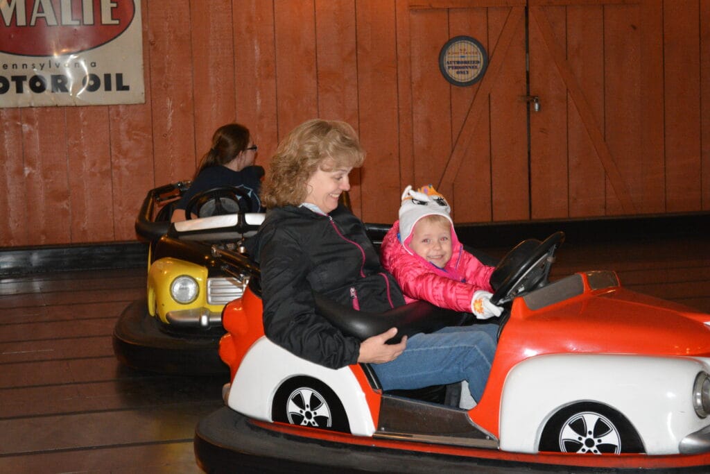 Country Fair at Dollywood: Rides, Nostalgia & Classic Fun for the Whole Family 4 Woman and Child on the Bumper Cars in Country Fair at Dollywood